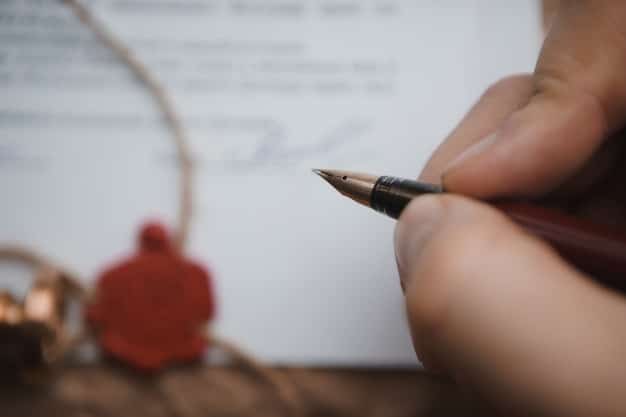 A close-up shot of a hand signing an ethical code of conduct document, symbolizing commitment to integrity in the workplace.