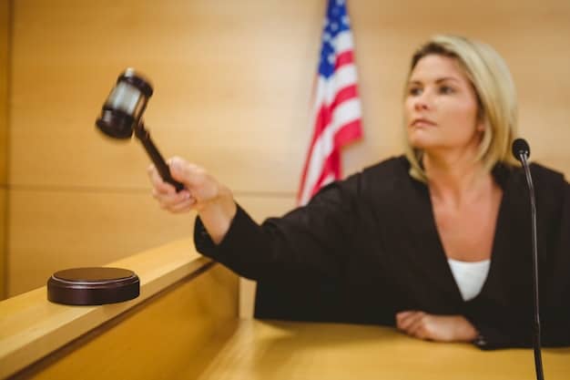 A close-up shot of a gavel hitting a sound block in a courtroom setting, with blurred figures of lawyers in the background. The image aims to symbolize the legal ramifications and penalties associated with FCPA violations.