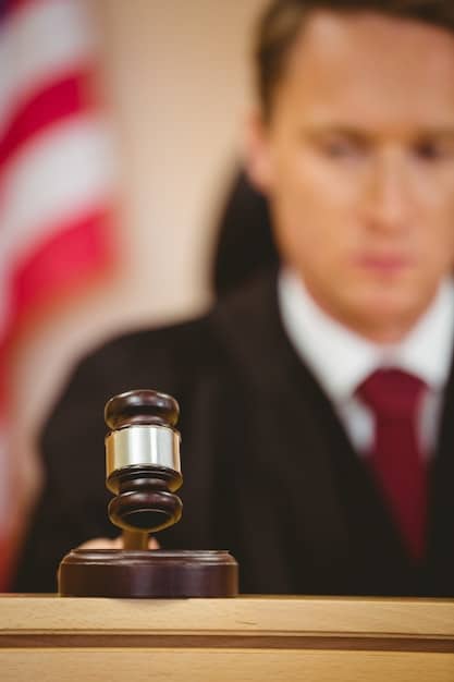 A gavel striking a sound block in a courtroom, symbolizing legal proceedings and judgments against corporations found guilty of unethical practices. The image conveys a sense of justice and accountability.